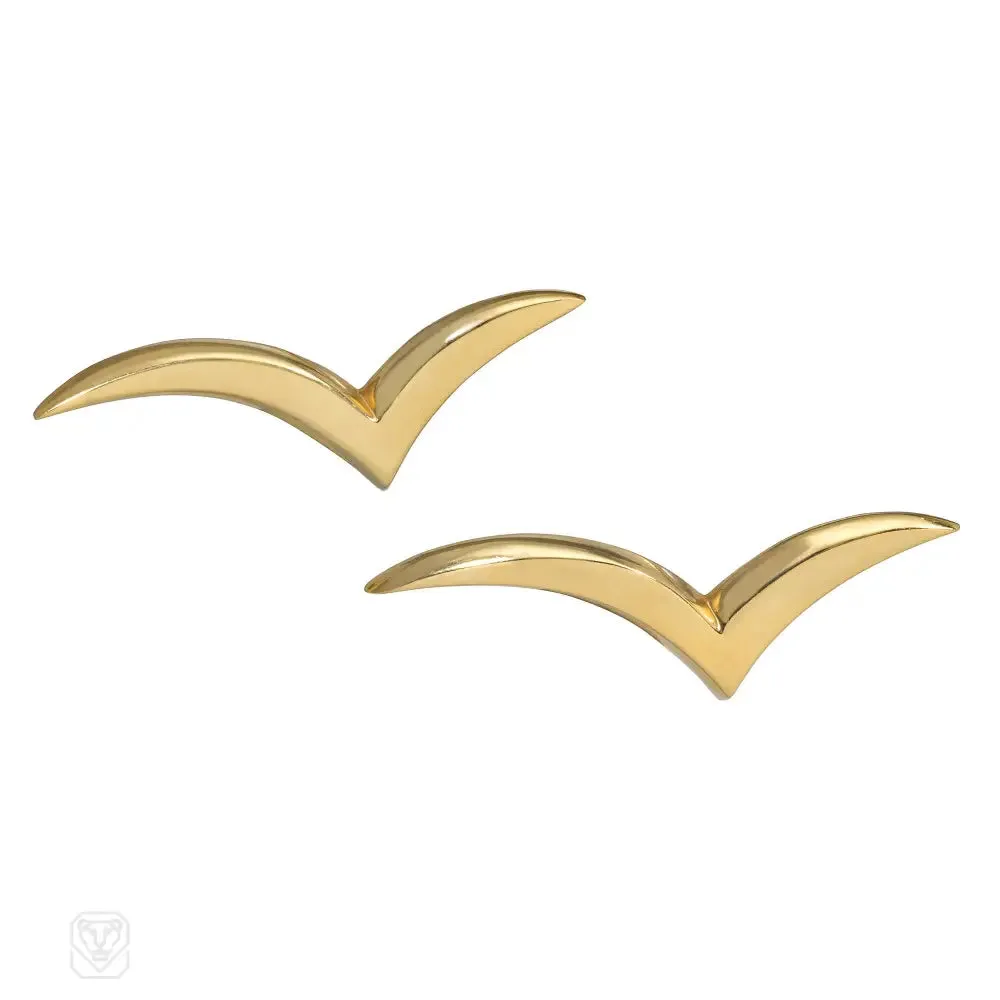 Pair of Tiffany gold stylized bird brooches